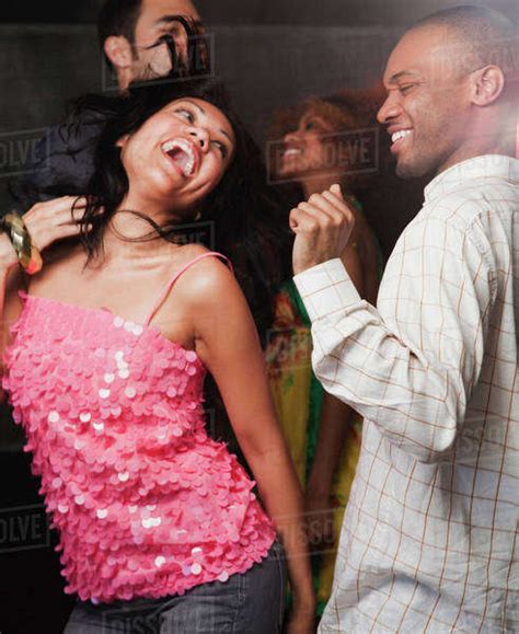 Couples Dancing At Nightclub Stock Photo Dissolve