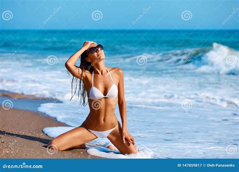 Portrait Of Beautiful Tanned Woman Posing In Colorful Swimwear Bikini