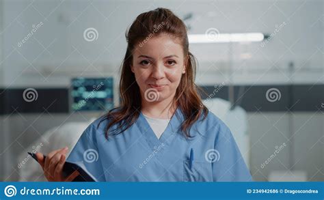 Close Up Of Medical Assistant Standing In Hospital Ward Stock Photo