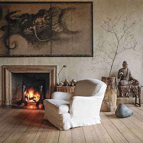A Living Room Filled With Furniture And A Fire Place Next To A Painting On The Wall