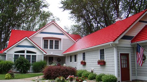 A House With Red Roof And White Siding