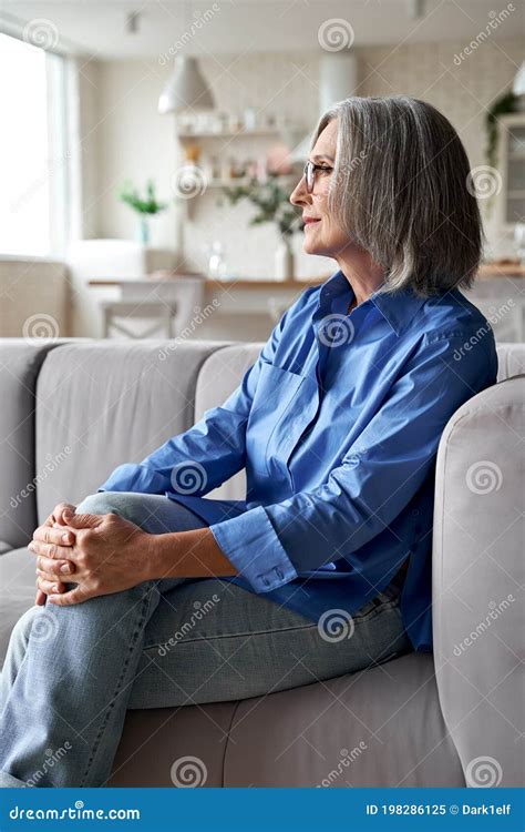 classy relaxed mature older woman relaxing sitting on couch at home stock image image of