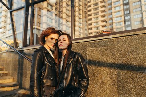 Premium Photo Street Portrait Of Two Attractive Girls In Leather Jackets Standing