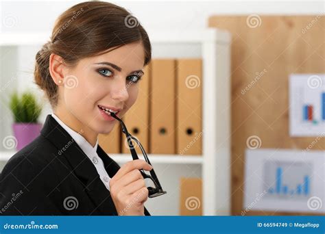 Beautiful Smiling Businesswoman Put Glasses In Mouth Stock Image