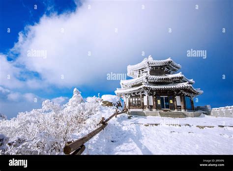 Wooden House Is Covered By Snow In Winter Deogyusan Mountains South