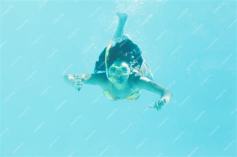 Premium Photo Brunette Swimming Underwater Wearing Snorkel