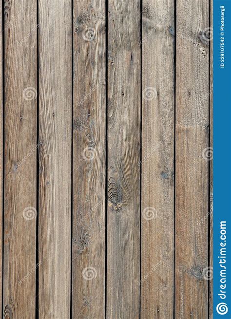 The Texture Of A Wooden Fence Made Of Unpainted Weathered Wood A High