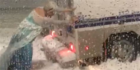 Drag Queen Dressed As Elsa Rescues Boston Police Van In Snow