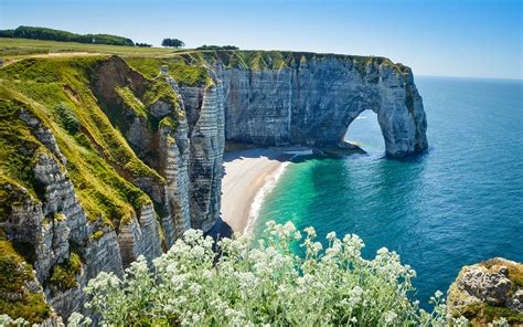 See the White Chalk Cliffs and Arches at Etretat in ...