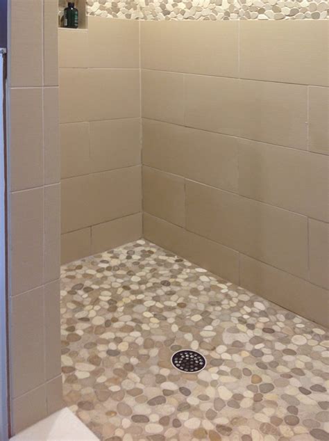 Sliced Tan And White Pebble Tile Shower Flooring And Border Tilehub