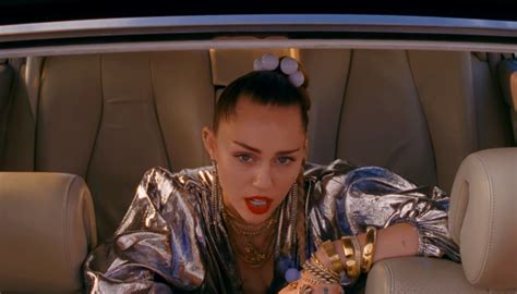 miley cyrus gets into a car chase in ‘nothing breaks like a heart video watch now mark