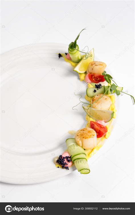 Fried Scallop On A White Plate Stock Photo By ©yuliiachupina 309552112