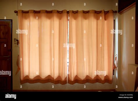 orange curtain and window in the house Stock Photo - Alamy