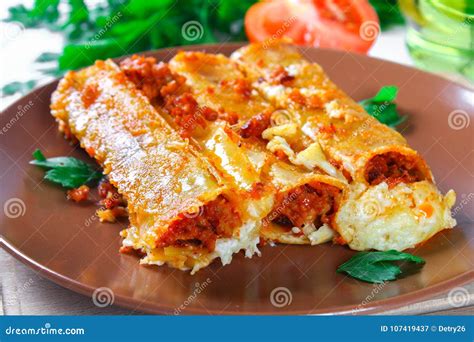 Traditional Italian Pasta Cannelloni Baked Tubes Stuffed With Minced Meat With Parmesan Cheese