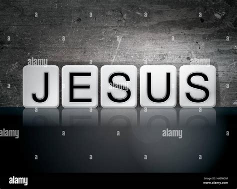 The Word Jesus Written In White Tiles Against A Dark Vintage Grunge