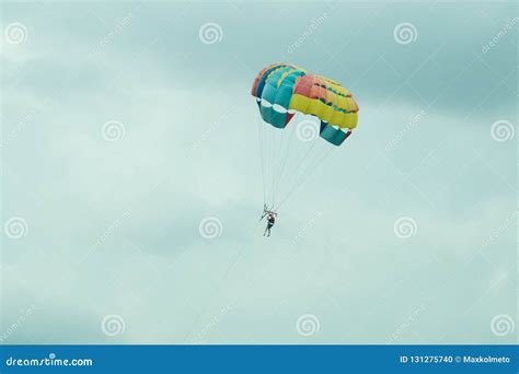 Skydiver Flying With A Colorful Parachute On Sky Background Editorial