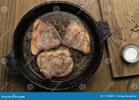 Three Fried Pork Steaks In A Frying Pan Stock Photo Image Of