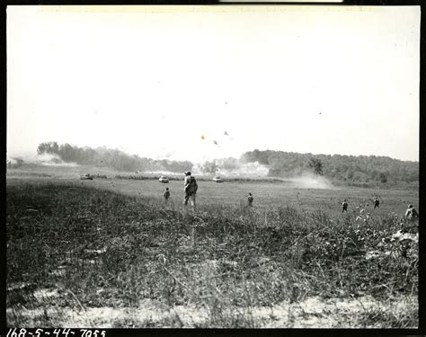 Members Of The 422nd Infantry Regiment Follow M 4 Tanks Across A Field