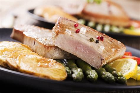 The trick is to a perfectly cooked tuna steak is to leave the center pink, much like a beef steak. How to Cook Tuna in a Grill Pan | LIVESTRONG.COM