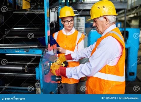 Workers Operating Machines At Modern Factory Stock Photo Image Of