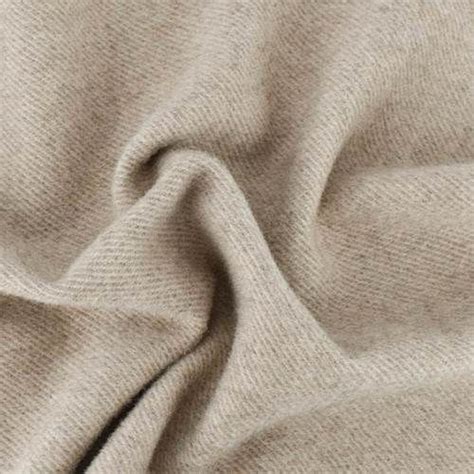 A Close Up View Of A Beige Fabric