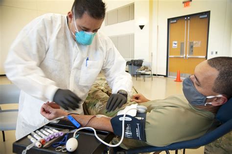 Service Members Donate Blood During The Armed Services Blood Program