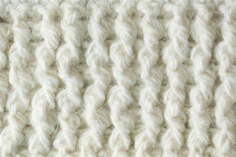 Knit Texture Of White Wool Knitted Fabric With Cable Pattern As
