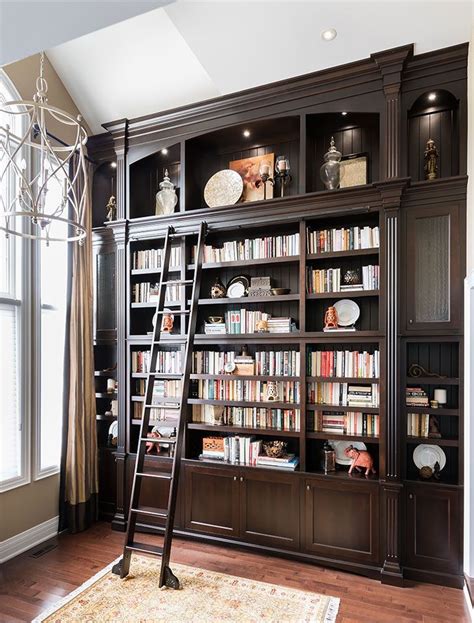 Dark Wood Bookcase With Ladder On Rail Home Library Design