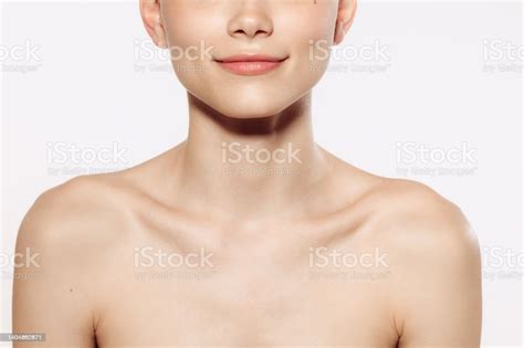Close Up Female Neck Collarbones Isolated On White Studio Background