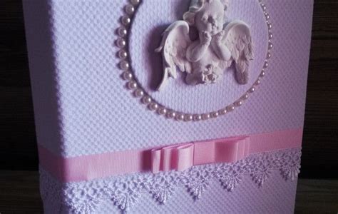 A Card With An Elephant On It And Pearls Around The Edges In Pink Tones