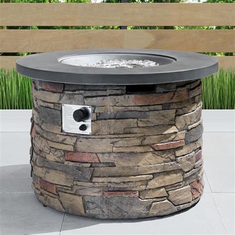 A wine barrel/wire spool table fire pit. Sego Lily Sage 35 in. x 24 in. Round Stone Propane Fire ...