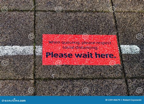 Please Wait Here Sign On The Side Walk Stock Image Image Of Modern