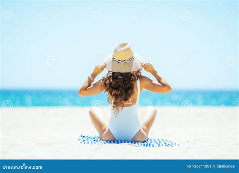 Trendy Woman Sitting On Striped Towel On Seacoast Stock Image Image Of Hair Beach