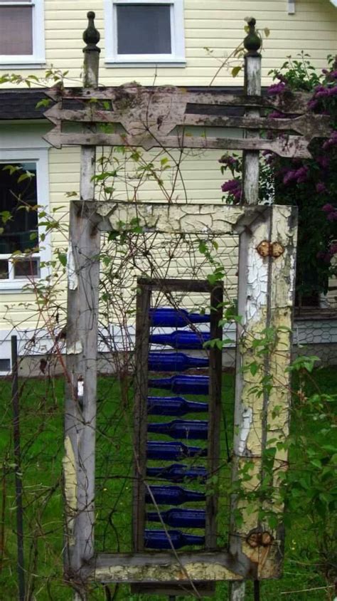 Garden Gate With Blue Wine Bottles Garden Art Bottle Trees Bottle Tree