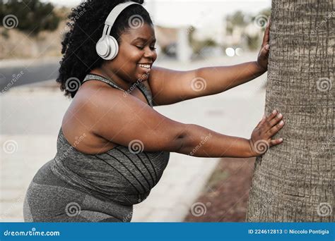 Curvy African Woman Doing Sport Workout Routine Outdoor In The City Focus On Face Stock Image