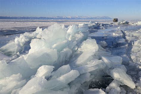 Broken Ice And Off Road Tourist Vehicle Baikal Lake Olkhon Island