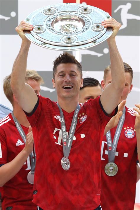 Robert Lewandowski Of Bayern Muenchen Lifts The Bundesliga Trophy Artofit