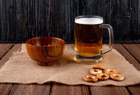 Free Photo Top View Of A Mug Of Beer With Various Salty Snacks On