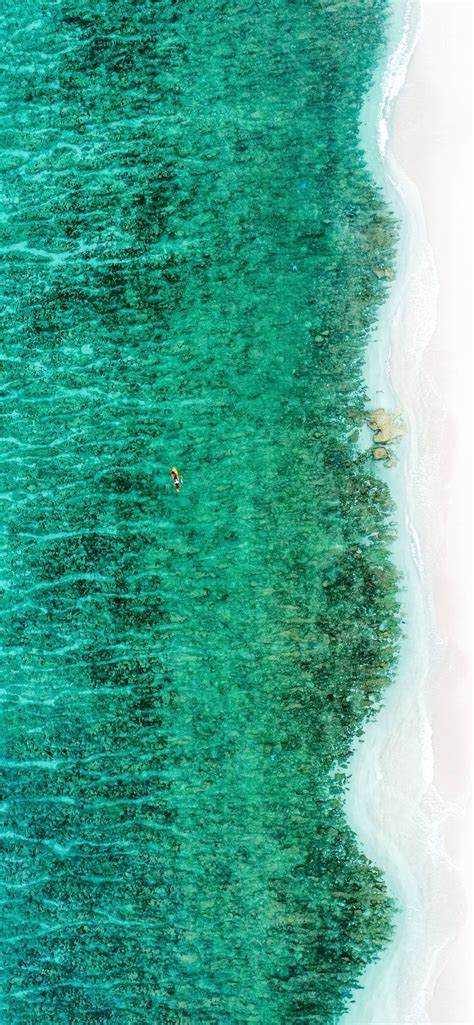 Aerial View Photography Of Ocean And Shore Iphone Wallpapers Free Download