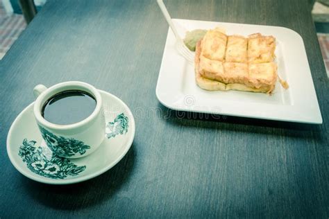 A kopitiam or kopi tiam is a traditional coffee shop found in southeast asia, patronised for kopi tiams in singapore are commonly found in almost all residential areas as well as some industrial and. Delicious Kaya Toast With Jam And Kopitiam Coffee Mug In ...