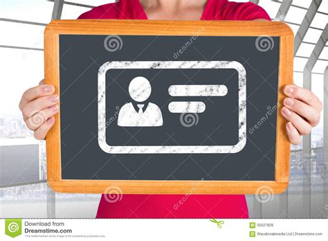 Composite Image Of Woman Showing Chalkboard To Camera Stock Photo