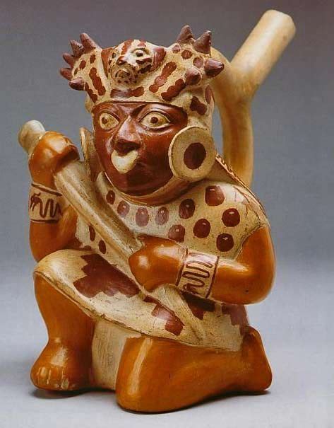moche ceramic pot vessel in the form of a recumbent anthropomorphic peasant playing the quena