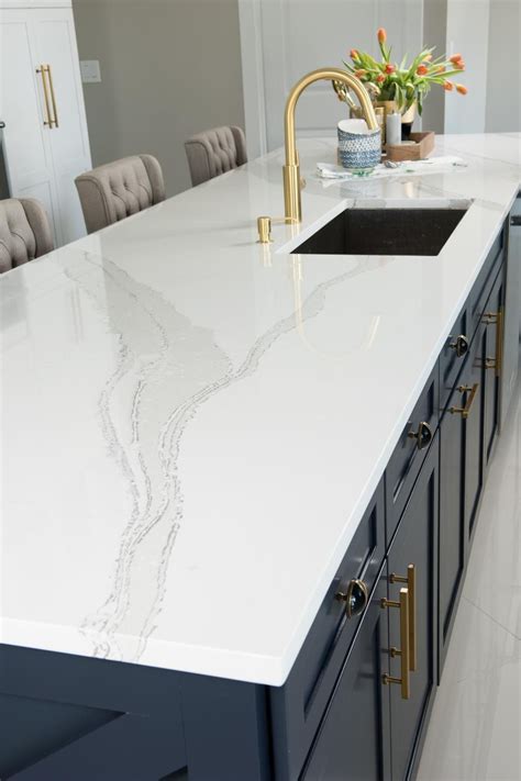 White Cambria Quartz Countertop On Wide Blue Kitchen Island Kitchen
