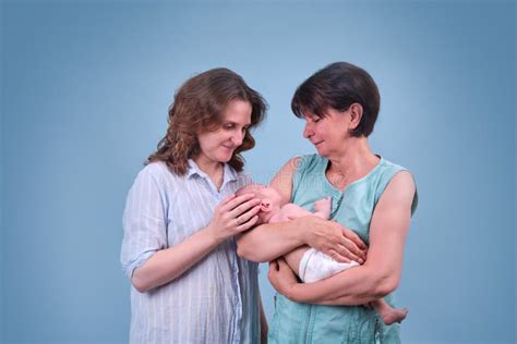 Happy Woman Mother Kissing A Newborn Baby Boy In Her Arms Black Studio