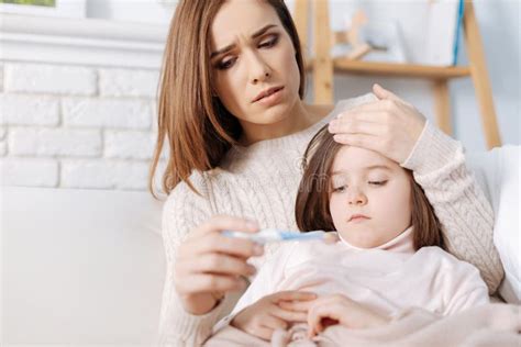 Troubled Loving Mother Taking Care Of Her Sick Daughter Stock Image Image Of Problem Cure
