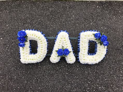 Grandad artifical white lilac artificial carnation based with small corsage sprays. Blue and white dad tribute funeral flowers | Dad funeral ...
