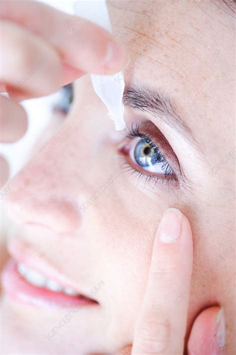 Woman Applying Eye Drops Stock Image C0315021 Science Photo Library