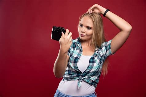 Free Photo Young Blonde Photograph Holding A Professional Camera And