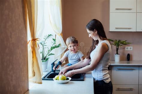 kitchen mom son wash fruits and vegetables stock image image of design friend 96024391