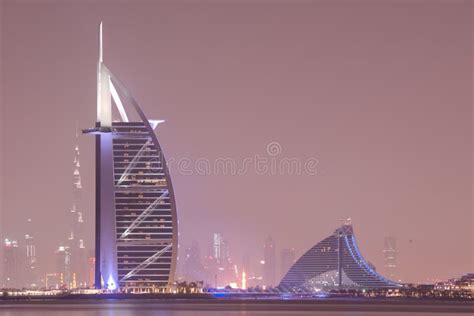 Iconic Burj Al Arab Hotel And The Adjacent Jumeirah Colony Night Scene